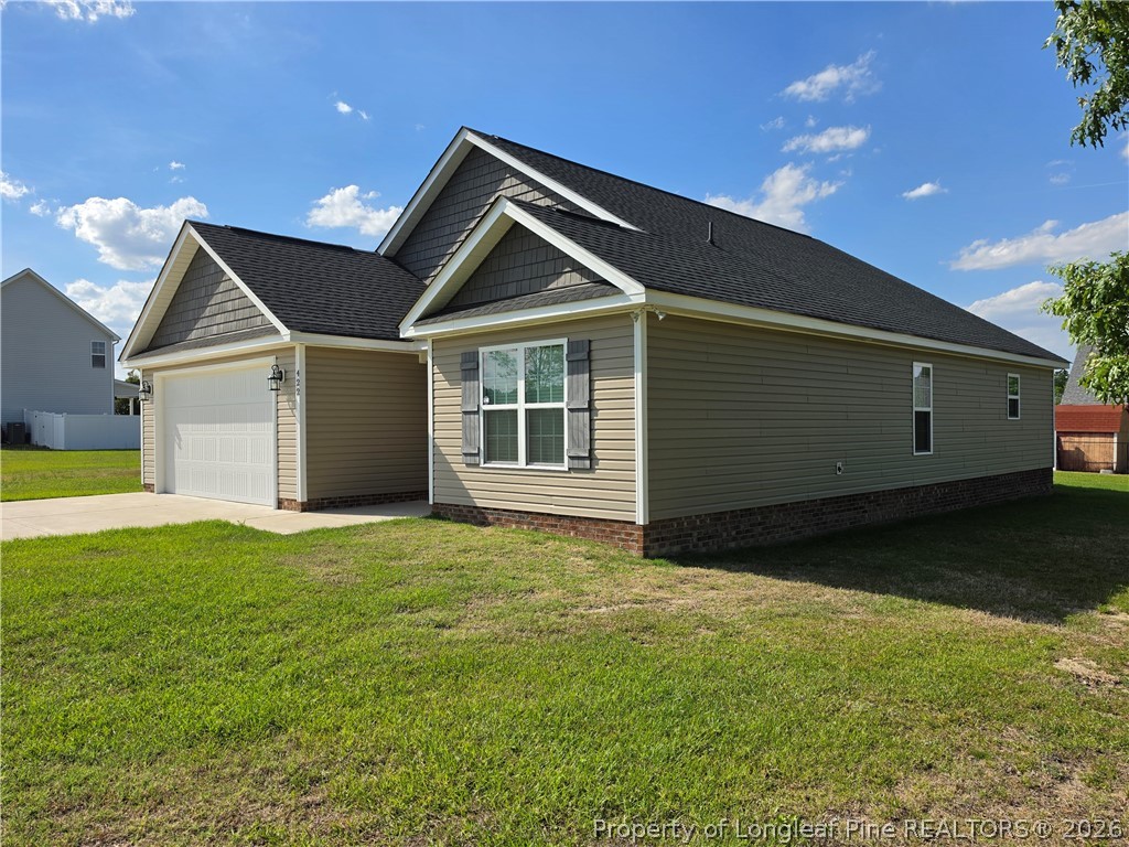 422 Mitchell Farm Road Goldsboro, NC 27530 - Photo 4 of 28 a view of an house with backyard and garden