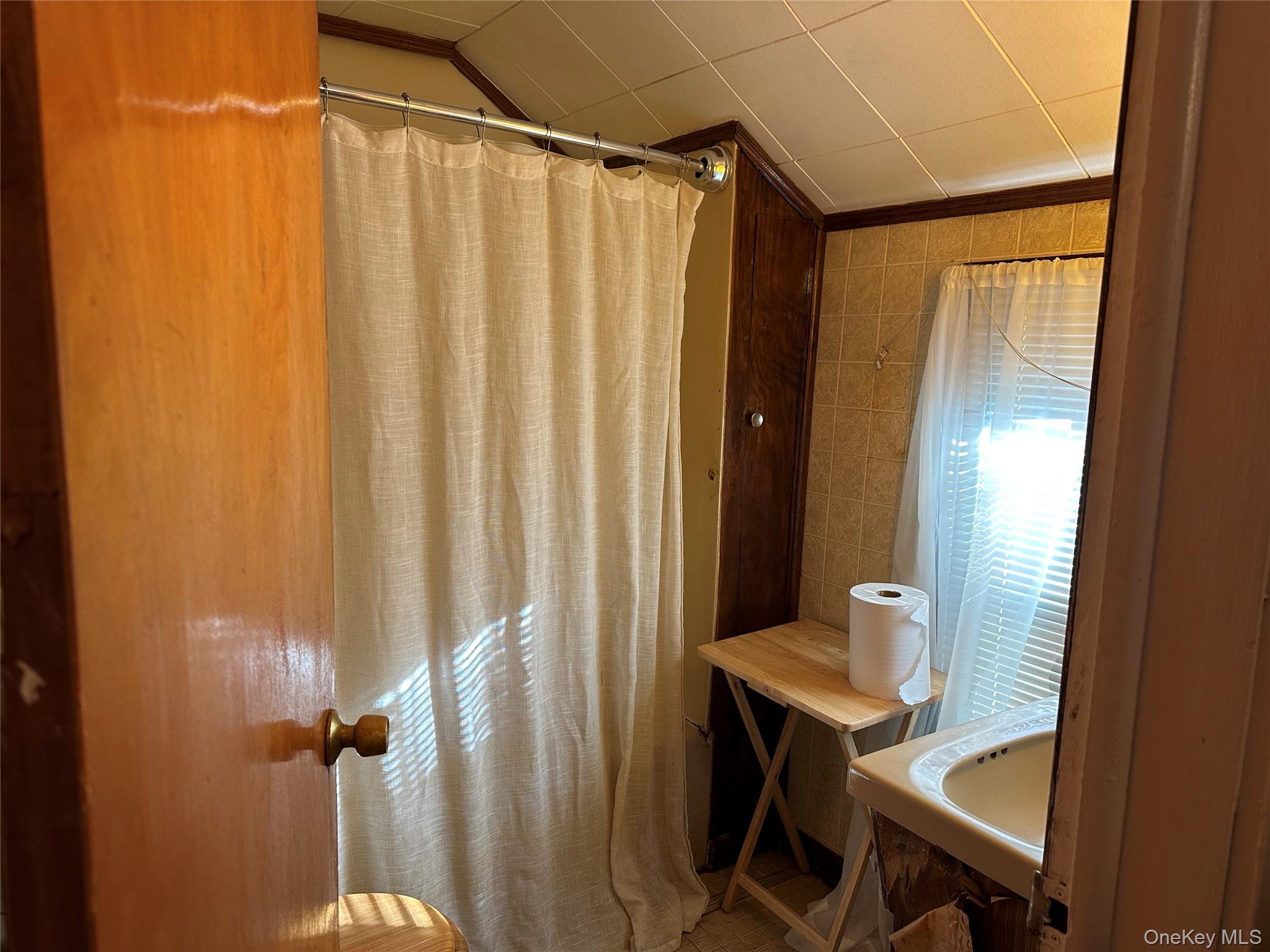 76 Church Street Beacon, NY 12508 - Photo 17 of 26 Bathroom featuring a shower with shower curtain