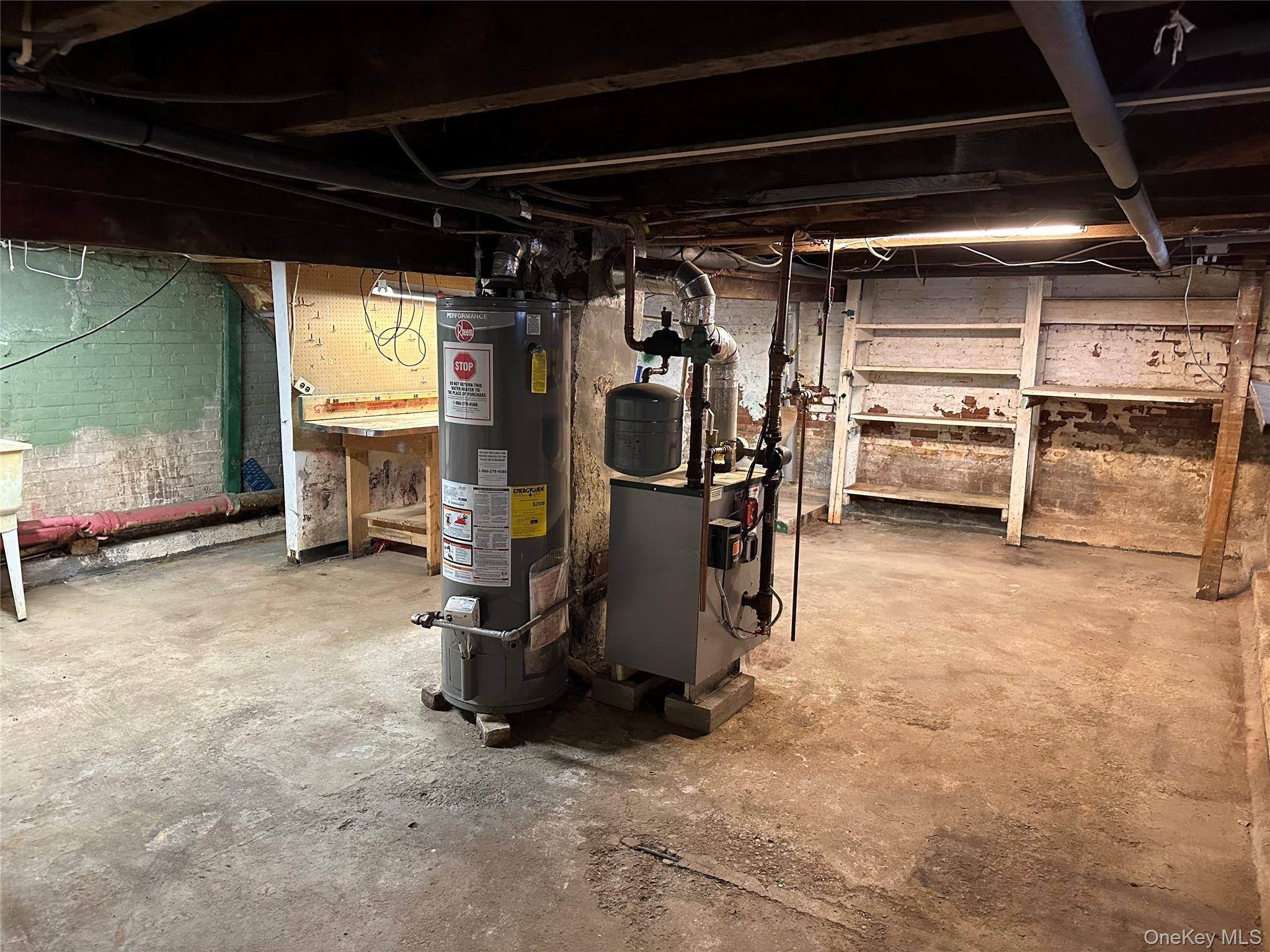 76 Church Street Beacon, NY 12508 - Photo 21 of 26 Unfinished basement with gas water heater and a heating unit