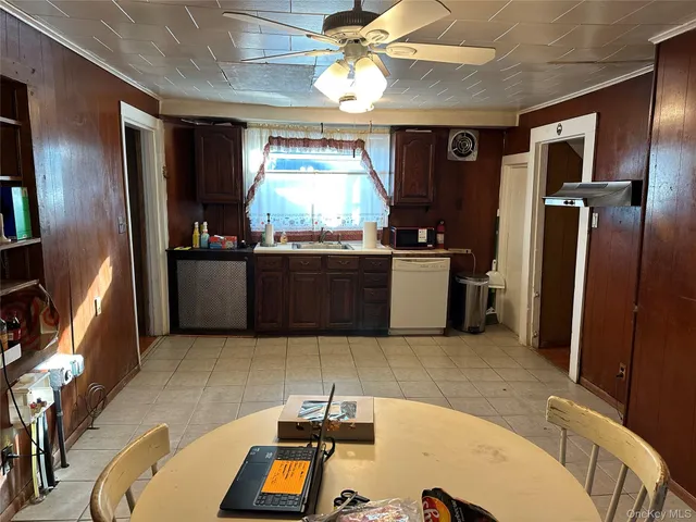 a kitchen with stainless steel appliances granite countertop a refrigerator a stove and a sink