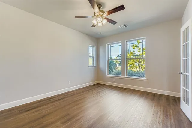 a large kitchen with kitchen island a sink stainless steel appliances and cabinets