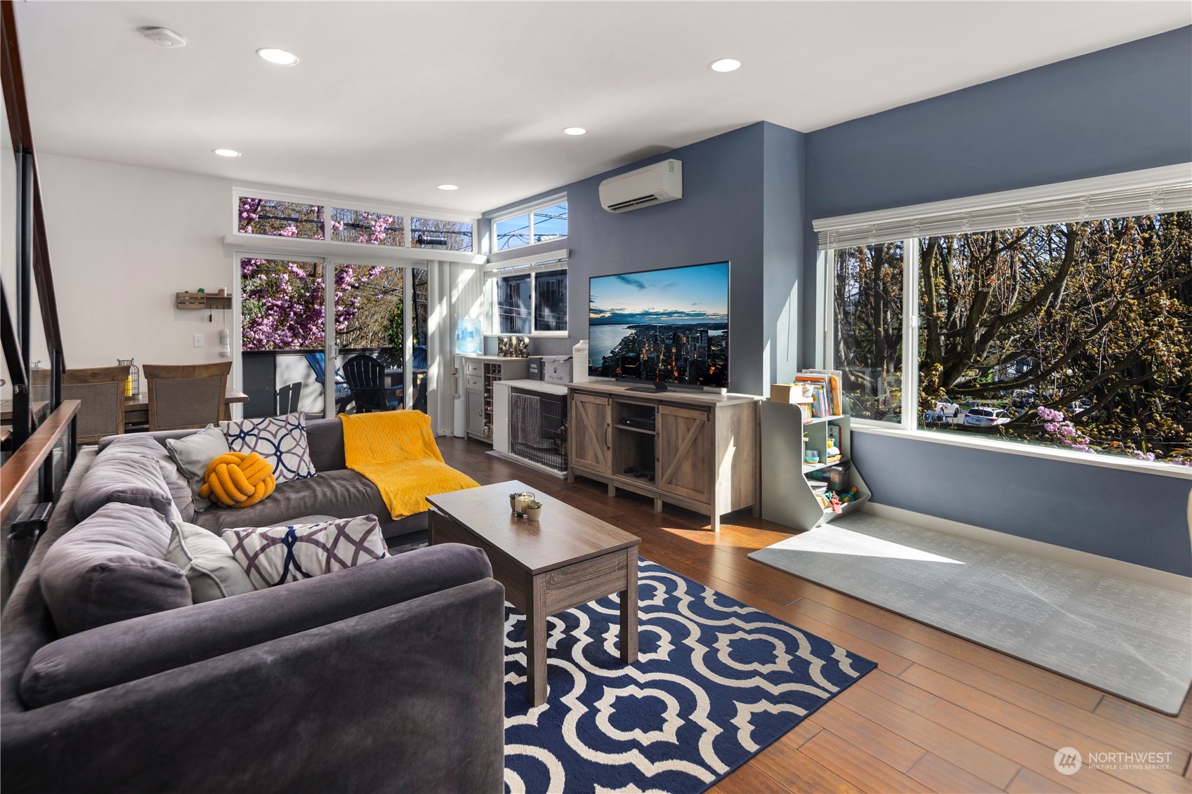 218 North 39th Street Seattle, WA 98103 - Photo 11 of 27 a living room with furniture flat screen tv and a large window