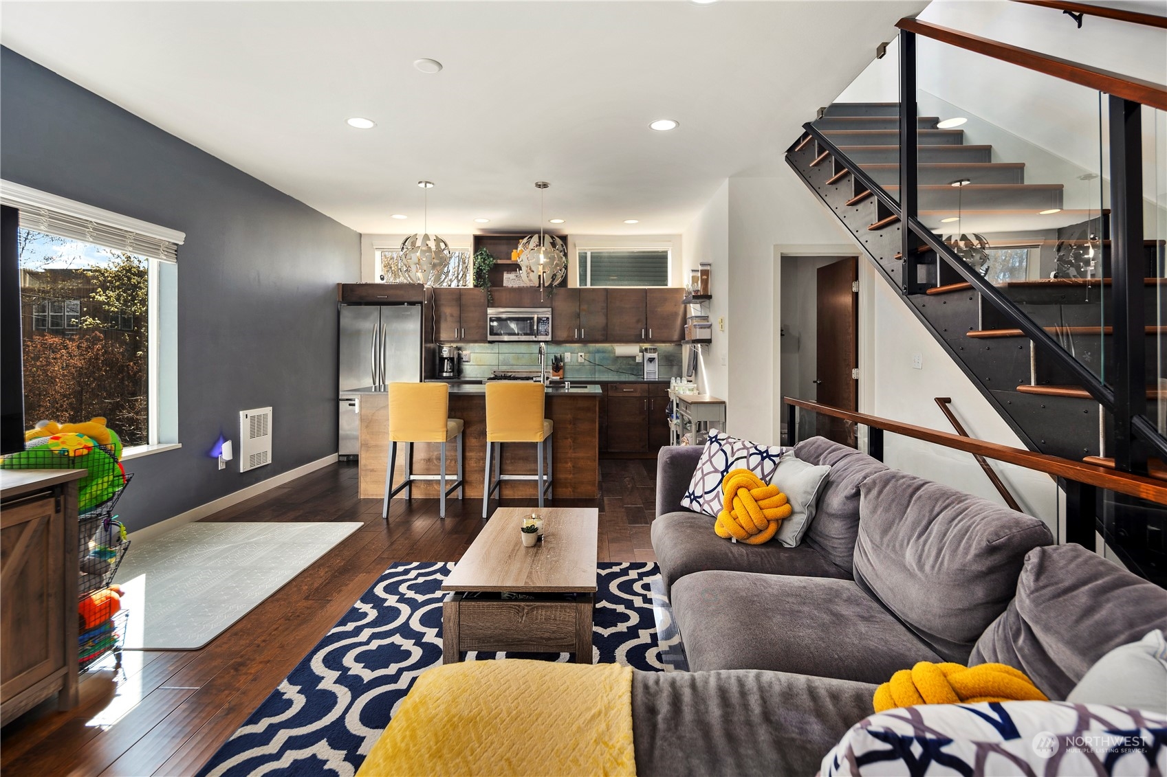 218 North 39th Street Seattle, WA 98103 - Photo 12 of 27 a living room with furniture and wooden floor
