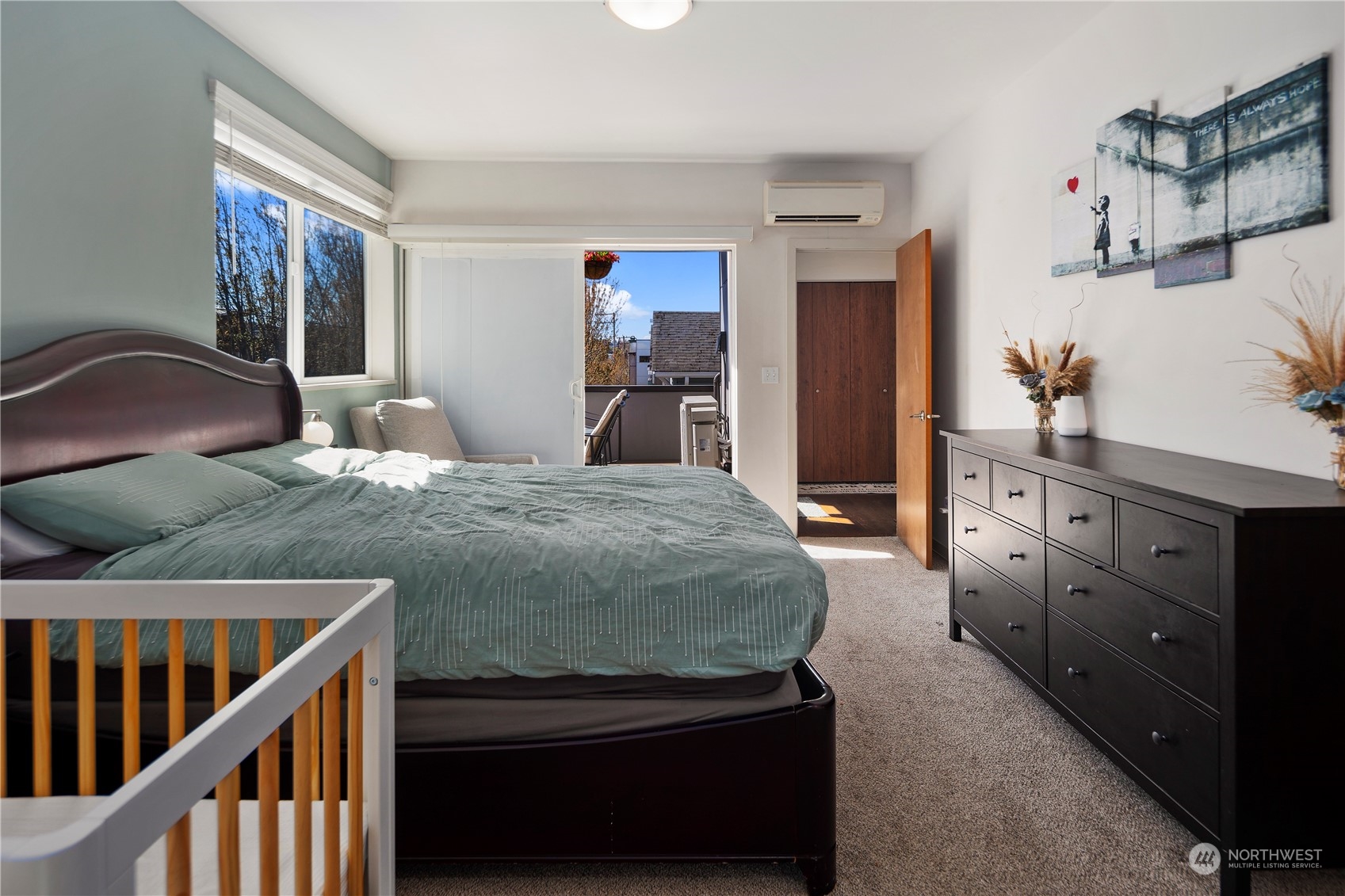 218 North 39th Street Seattle, WA 98103 - Photo 20 of 27 a bedroom with a bed and dresser