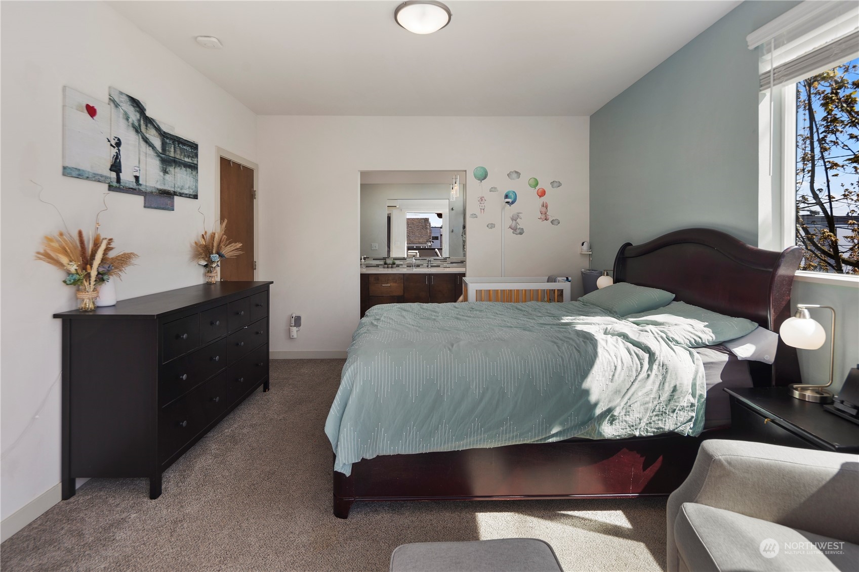 218 North 39th Street Seattle, WA 98103 - Photo 21 of 27 a bedroom with a bed and window
