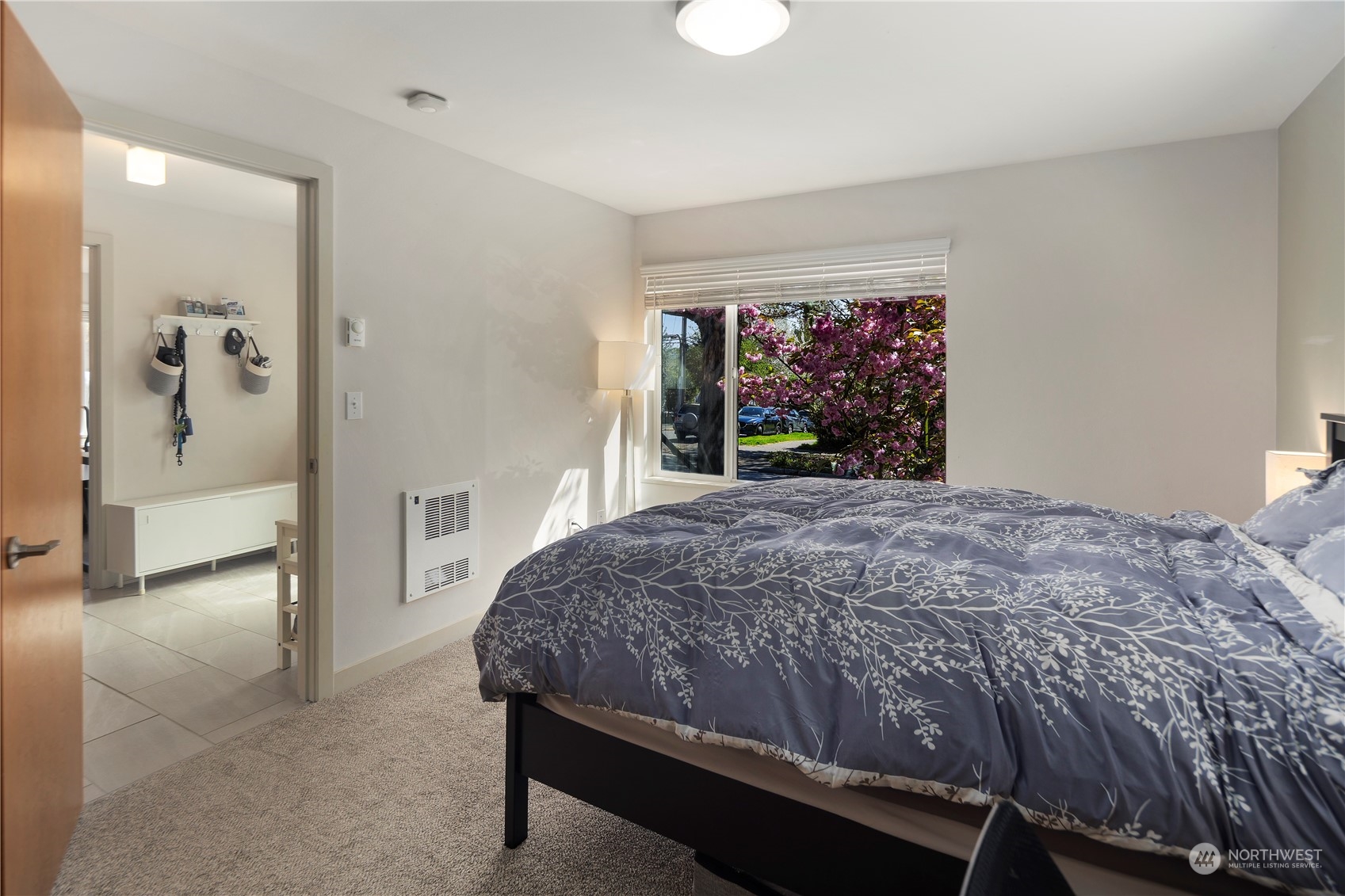 218 North 39th Street Seattle, WA 98103 - Photo 5 of 27 a bedroom with a large bed and a large window