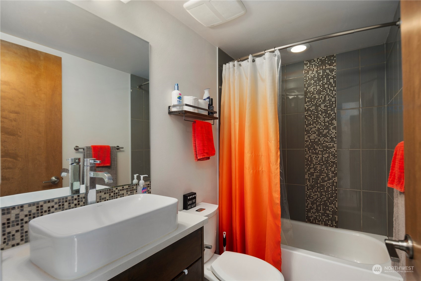 218 North 39th Street Seattle, WA 98103 - Photo 6 of 27 a bathroom with a sink vanity mirror and toilet