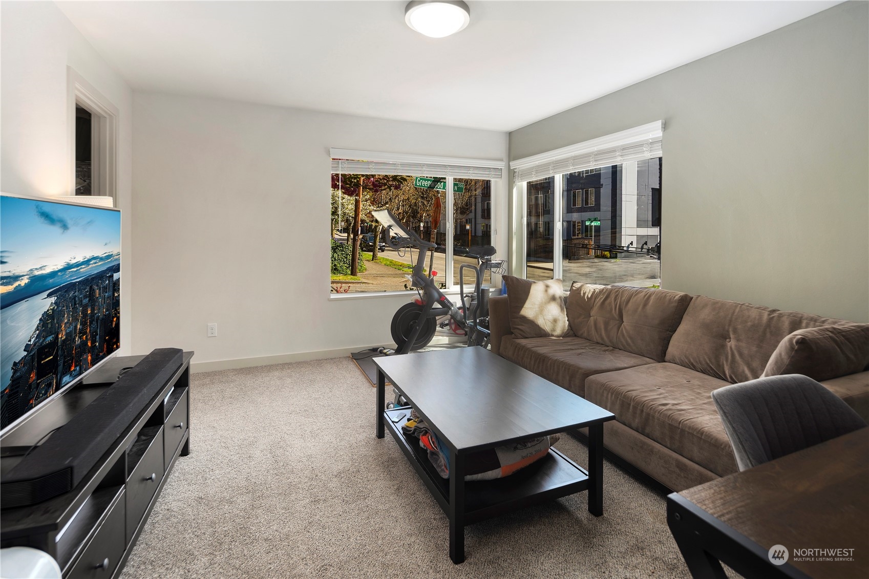 218 North 39th Street Seattle, WA 98103 - Photo 7 of 27 a living room with furniture and a flat screen tv