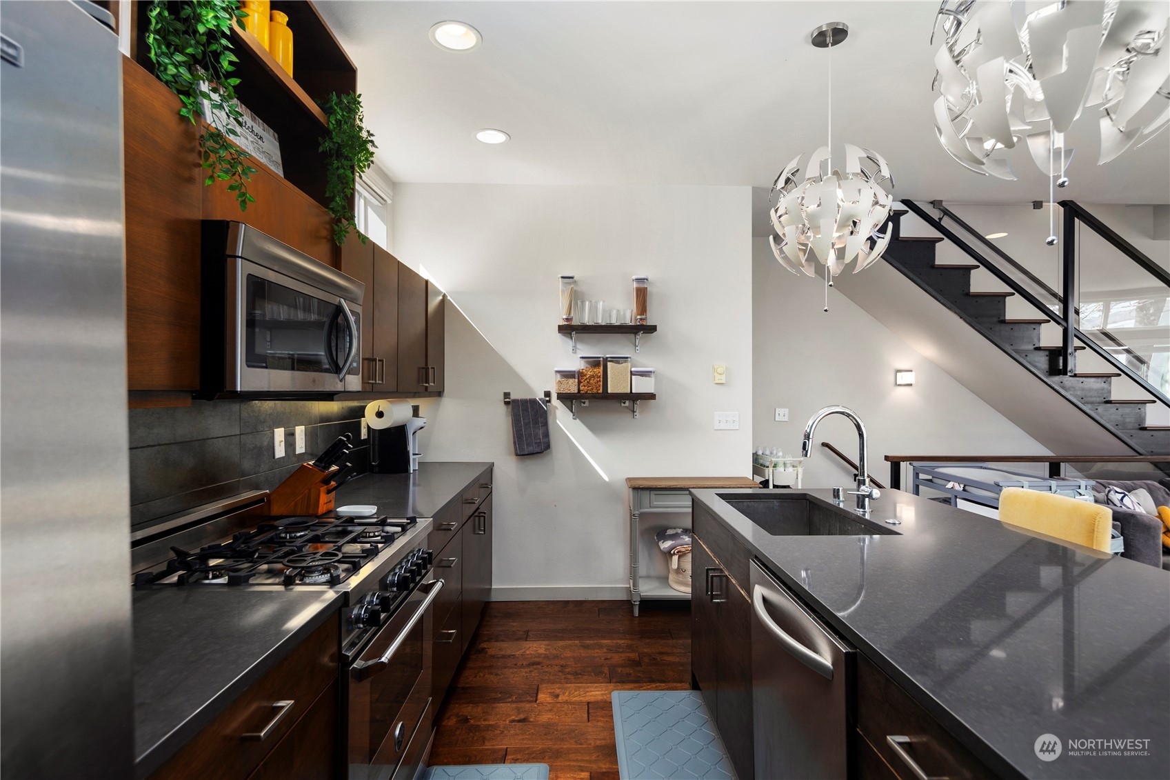 218 North 39th Street Seattle, WA 98103 - Photo 10 of 27 a kitchen with a sink stainless steel appliances and cabinets