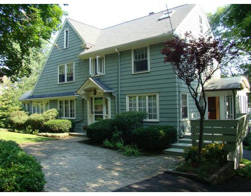 28 Byfield Road Newton, MA 02468 - Photo 1 of 8 a view of a house with yard and plants
