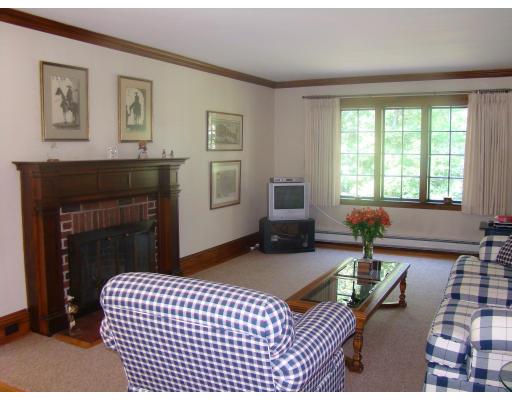 28 Byfield Road Newton, MA 02468 - Photo 3 of 8 a bedroom with furniture and a fireplace