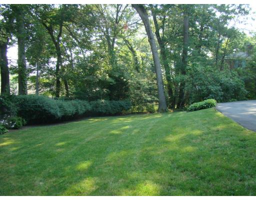 28 Byfield Road Newton, MA 02468 - Photo 8 of 8 a view of a grassy field with trees in the background