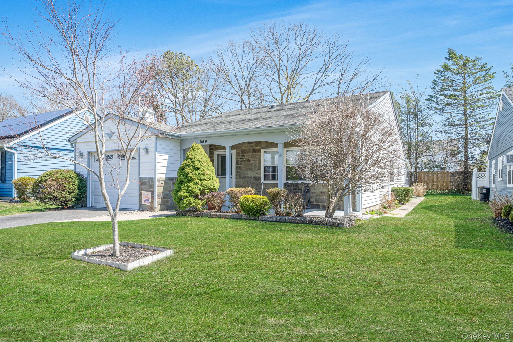 259 Edinburgh Drive Ridge, NY 11961 - Photo 1 of 31 a view of a house with a yard and a large tree