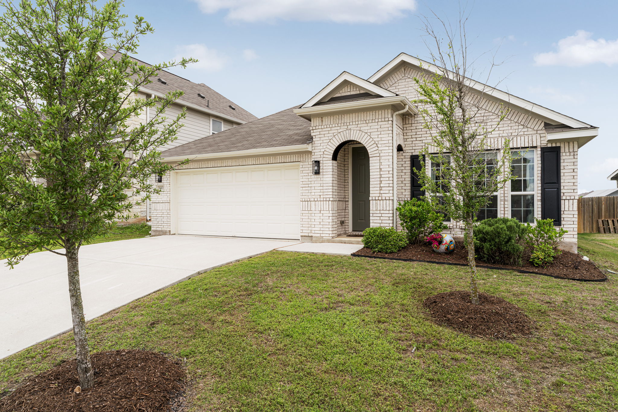 19412 Forman Drive Pflugerville, TX 78660 - Photo 31 of 34 The inviting brick exterior and covered front entry create warm curb appeal and a welcoming first impression as you arrive at the home.