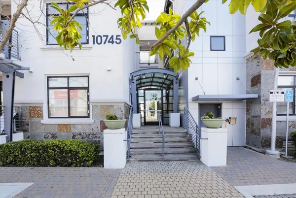 a front view of a building with outdoor seating