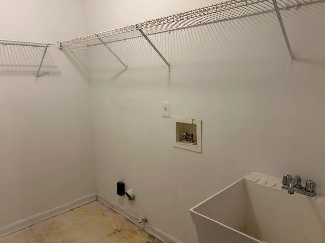 a bathroom with a window and a shower