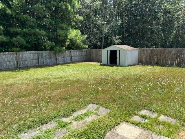 a bathroom with a shower and a yard