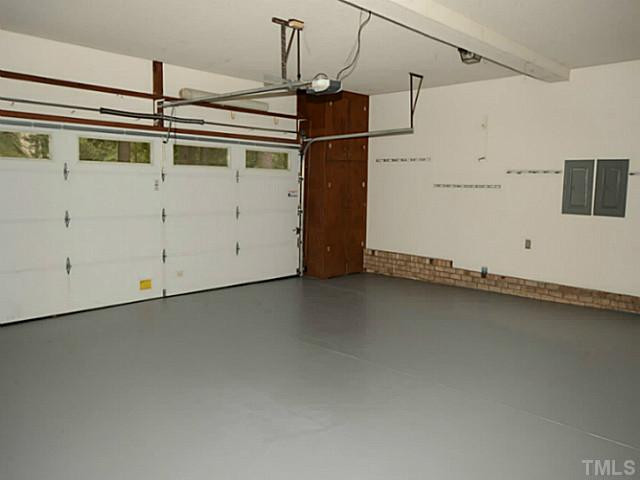 8521 Kempton Road Raleigh, NC 27615 - Photo 24 of 25 This over sized garage is an amazing addition to the property. Freshly painted walls and floors. There is a workshop area in the rear of the garage. There are two parking pads off the garage. Great for additional vehicles, boats, RV's. Parking Lot/Garage