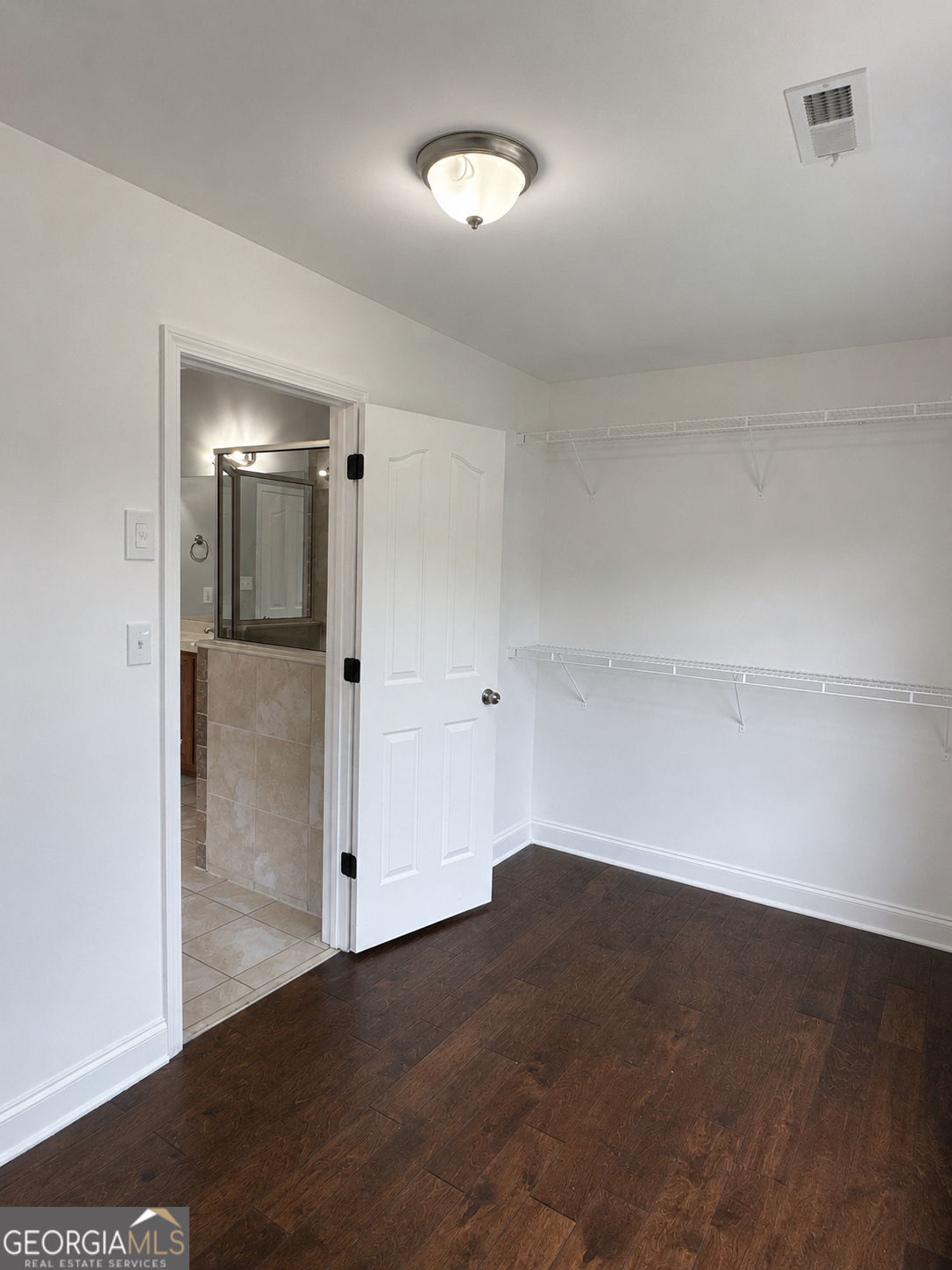2614 Dolostone Way Dacula, GA 30019 - Photo 22 of 29 wooden floor in an empty room