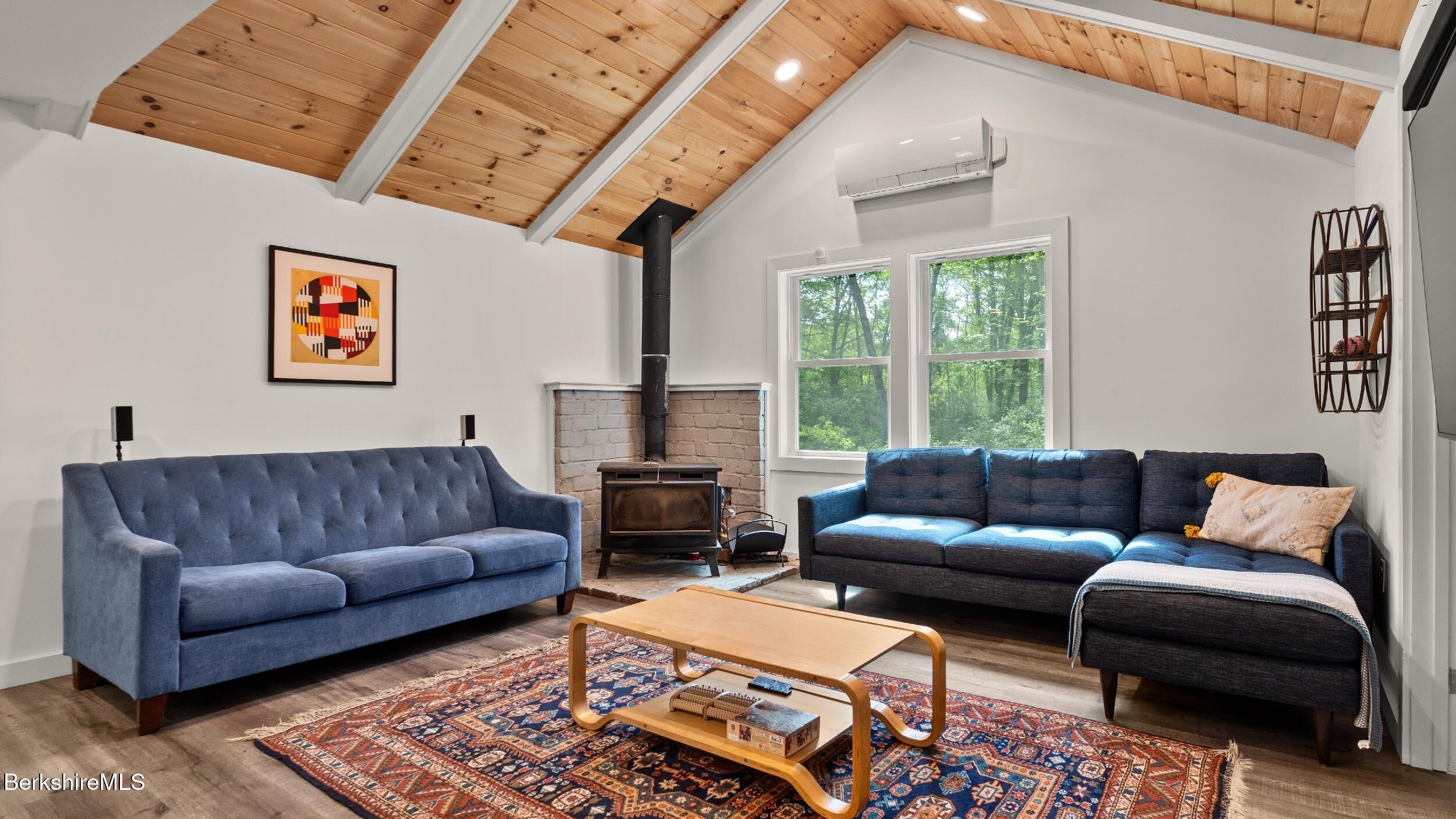 418 Monterey Road Great Barrington, MA 01230 - Photo 3 of 28 a living room with furniture and a large window