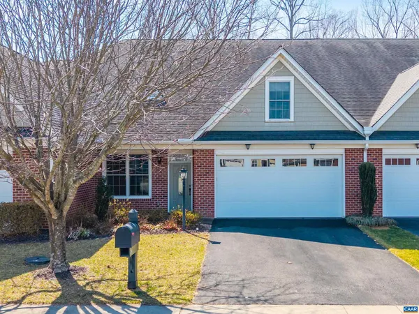 a front view of house with yard outdoor seating and barbeque oven
