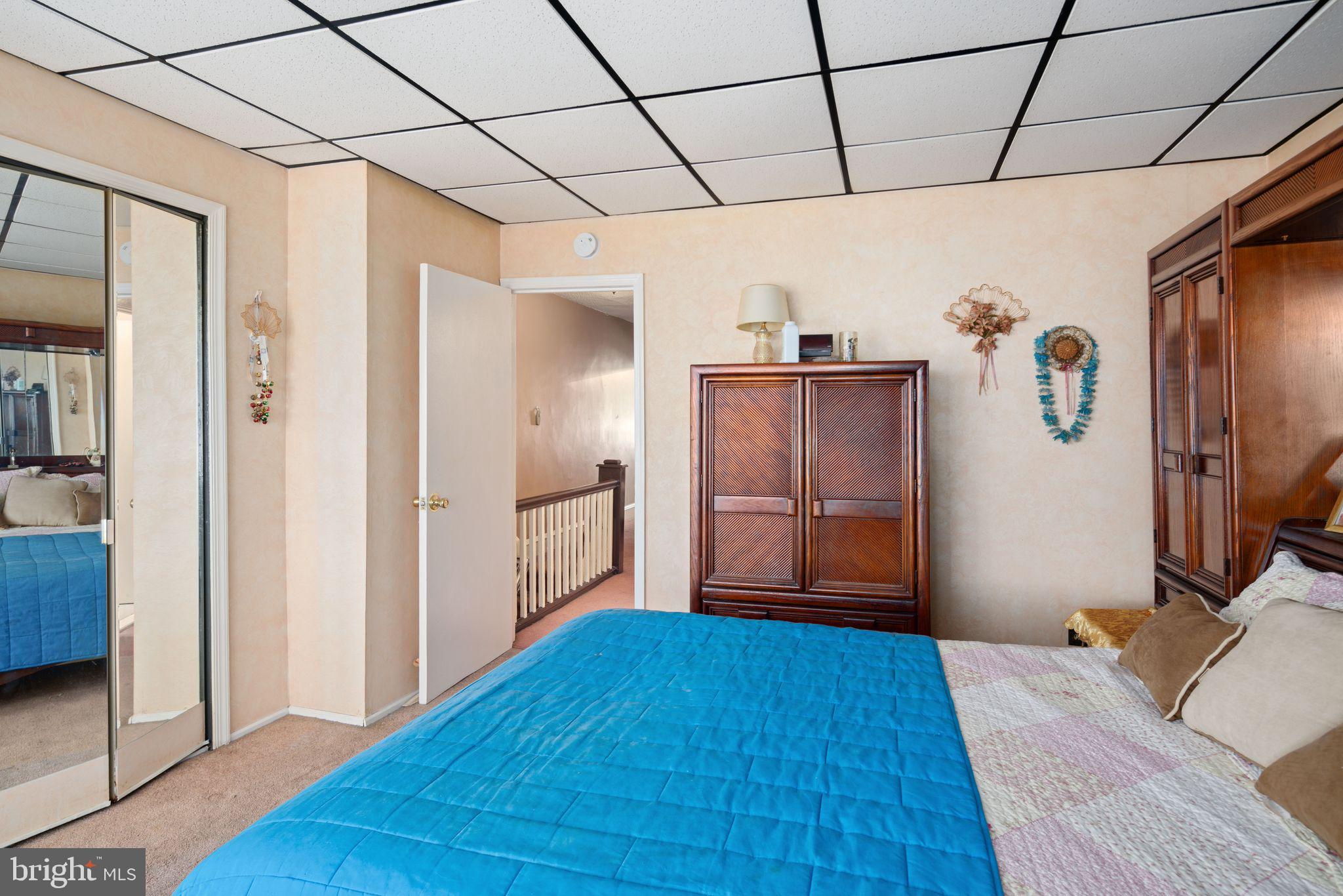 7818 Lennox Road Upper Darby, PA 19082 - Photo 15 of 28 a bedroom with a bed and wooden floor