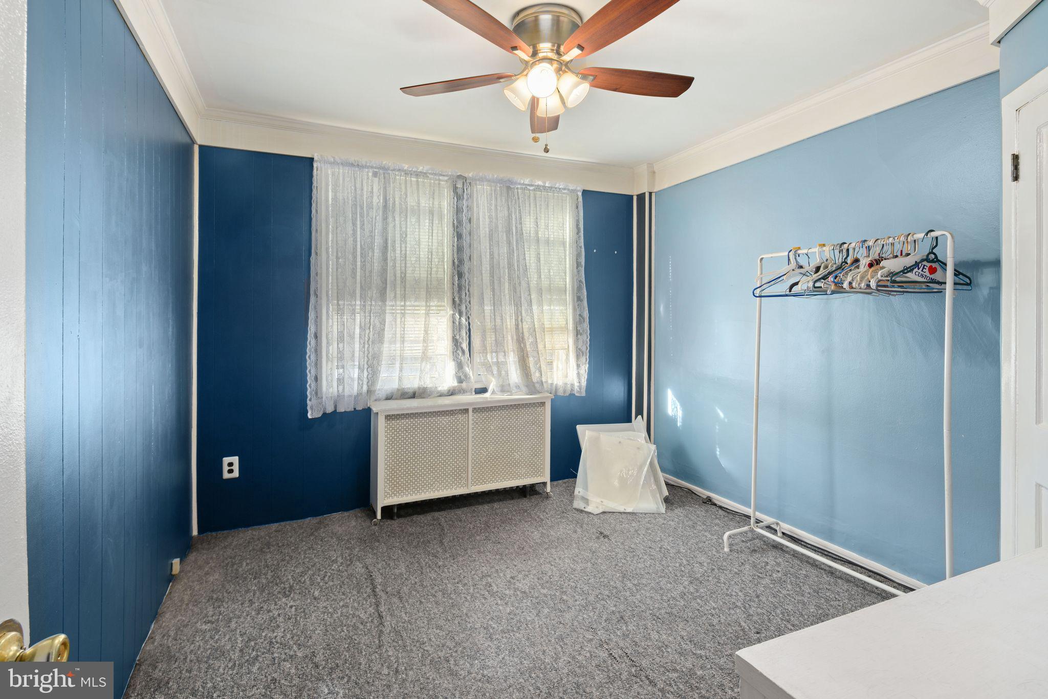 7818 Lennox Road Upper Darby, PA 19082 - Photo 16 of 28 a bedroom with a bed and a window