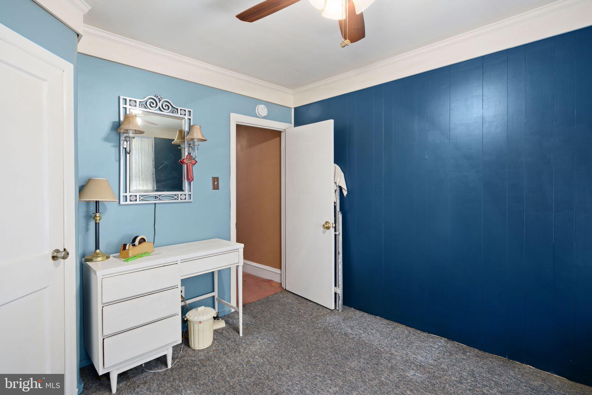 7818 Lennox Road Upper Darby, PA 19082 - Photo 17 of 28 a room with furniture and mirror
