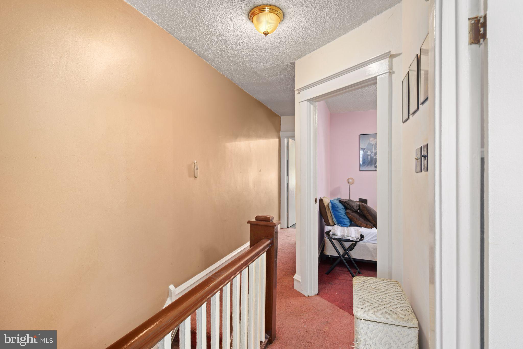 7818 Lennox Road Upper Darby, PA 19082 - Photo 18 of 28 a view of a hallway and a livingroom with couch