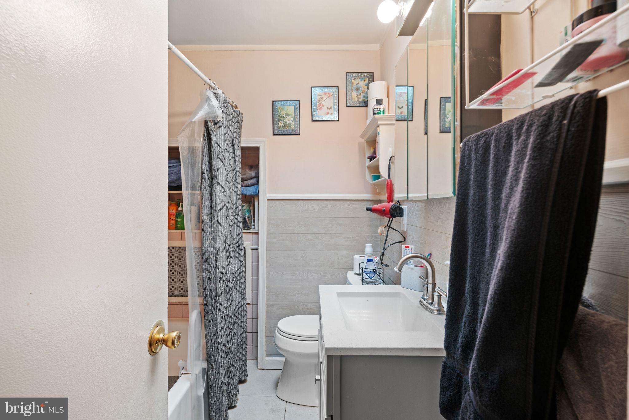 7818 Lennox Road Upper Darby, PA 19082 - Photo 21 of 28 a bathroom with a sink toilet and shower