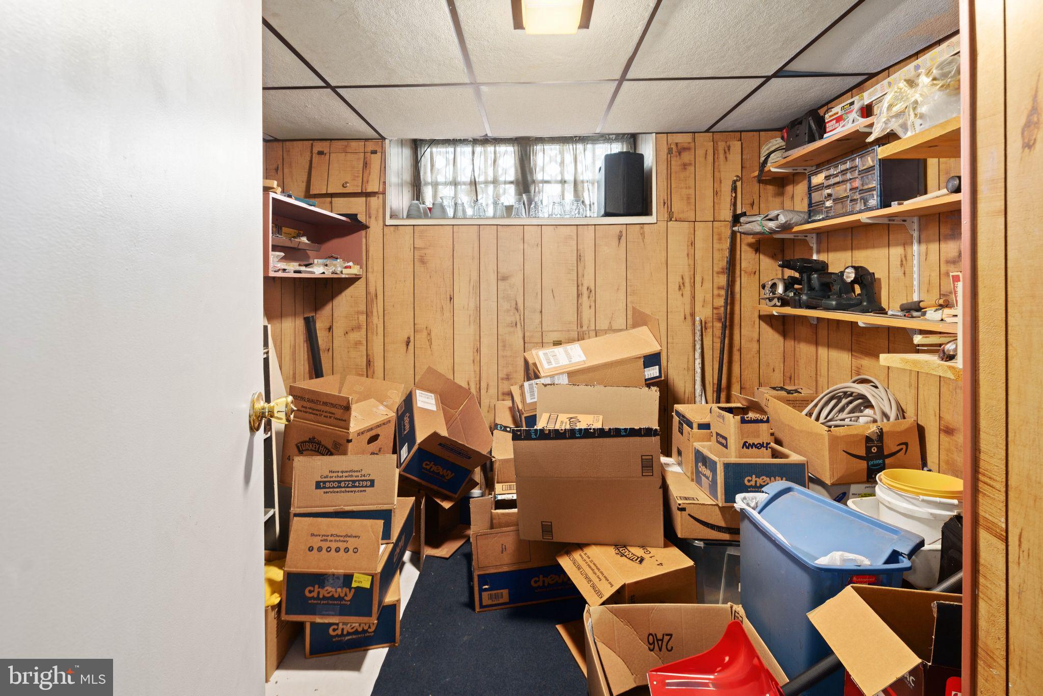 7818 Lennox Road Upper Darby, PA 19082 - Photo 26 of 28 a view of walk in closet with clothes and shoes