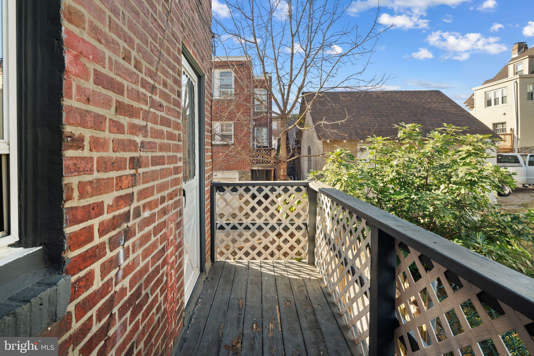7818 Lennox Road Upper Darby, PA 19082 - Photo 27 of 28 a view of a balcony with wooden floor and fence