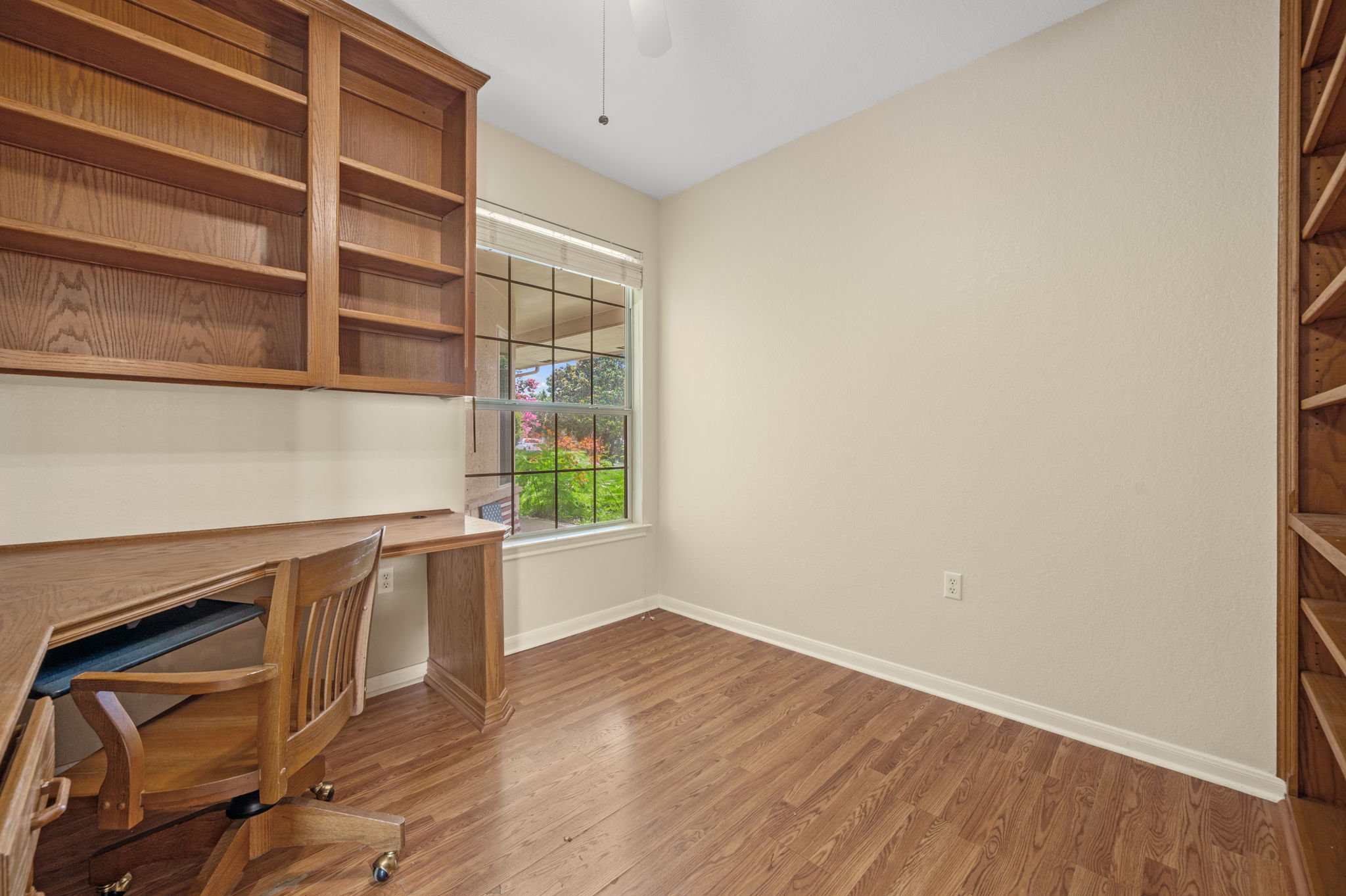 118 Bass Street Georgetown, TX 78633 - Photo 30 of 40 Custom built-in desk and shelving create a functional and organized workspace.