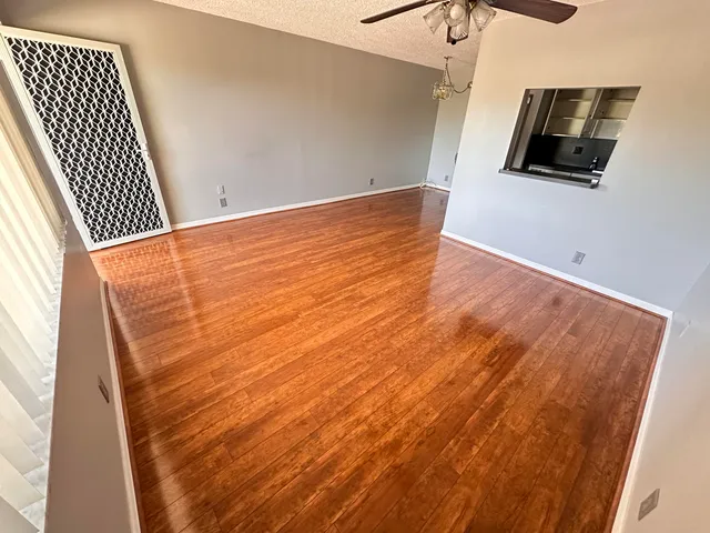 a view of room with wooden floor