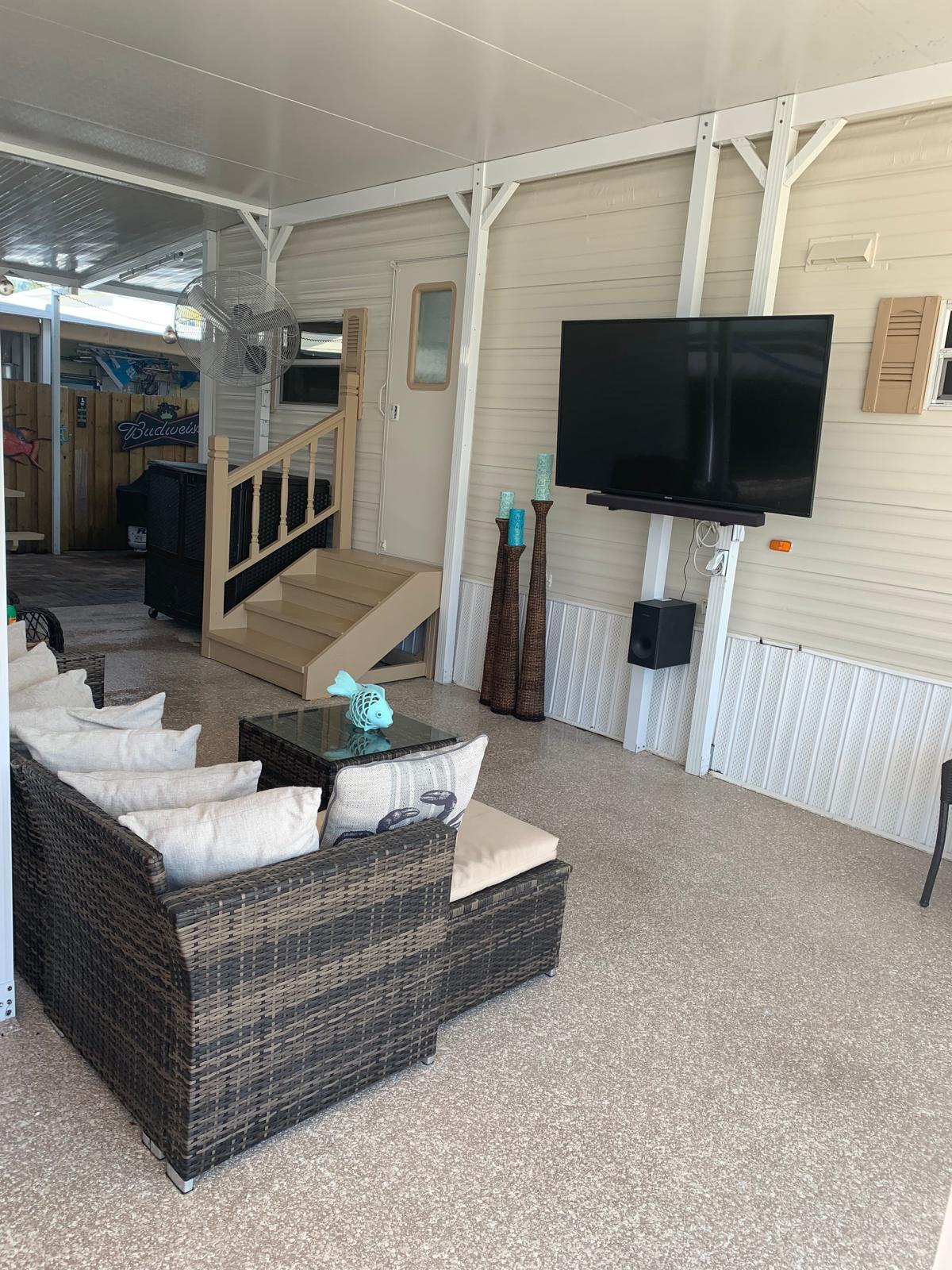 325 Calusa Street, Unit 454 Key Largo, FL 33037 - Photo 15 of 23 a living room with furniture and a flat screen tv