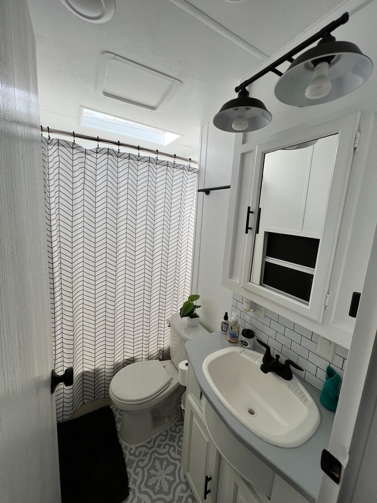 325 Calusa Street, Unit 454 Key Largo, FL 33037 - Photo 8 of 23 a bathroom with a sink toilet and shower