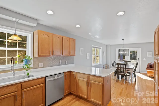 a kitchen with sink cabinets and dining table