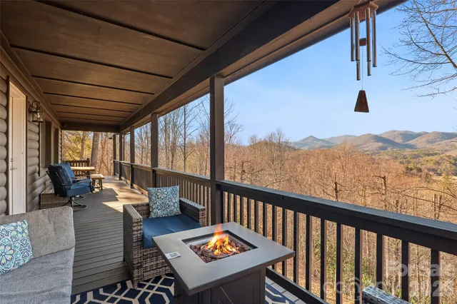 a balcony with furniture and a rug