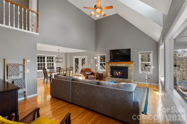 a living room with fireplace furniture and a flat screen tv