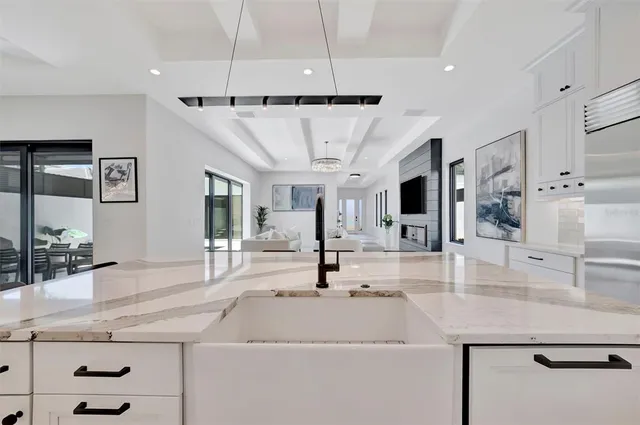 a view of living room filled with furniture and wooden floor