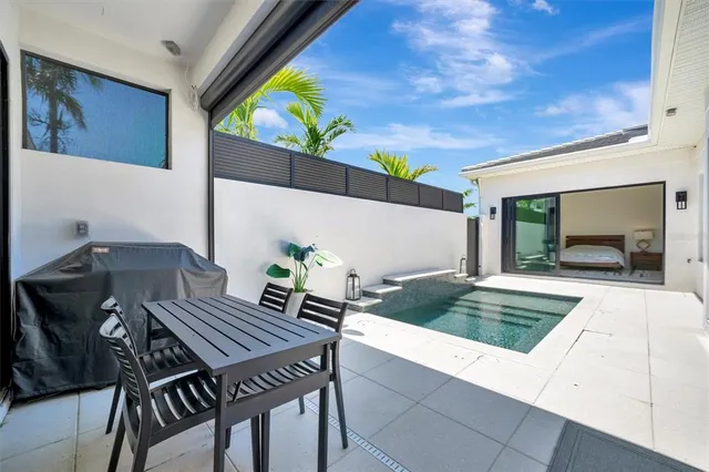 a view of swimming pool with seating space