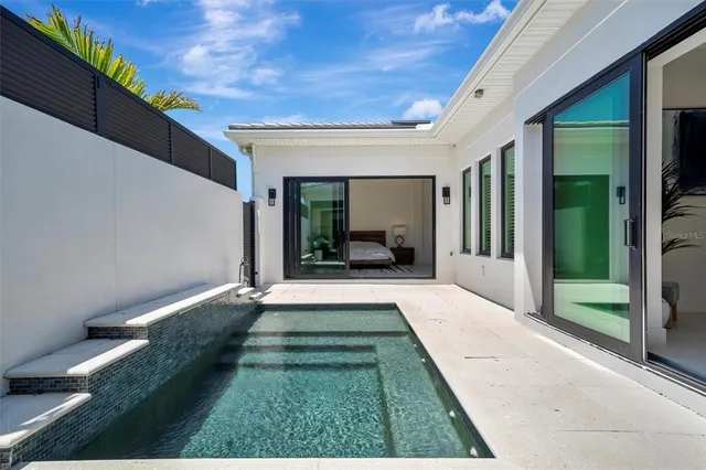 a bathroom with a double vanity sink mirror and toilet