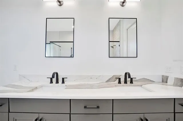 a bedroom with a bunk bed and a window