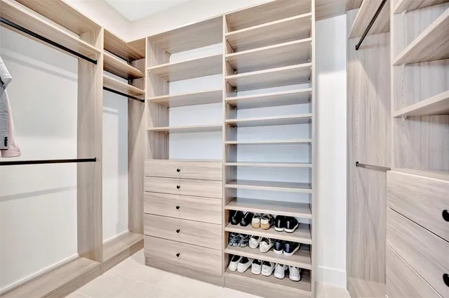 a close view of a sink and cabinets