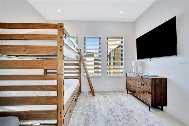 an aerial view of a house with a lake view