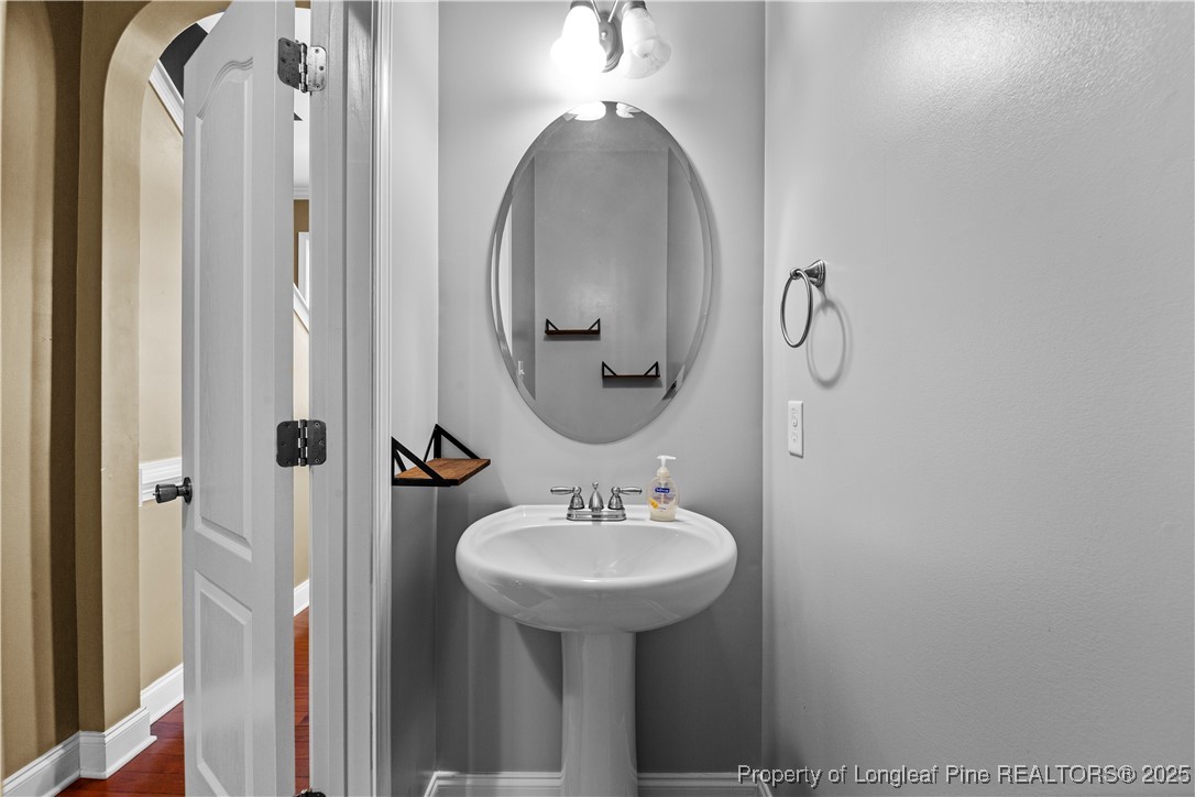 178 Tun Tavern Drive Cameron, NC 28326 - Photo 14 of 30 a bathroom with a sink and a mirror