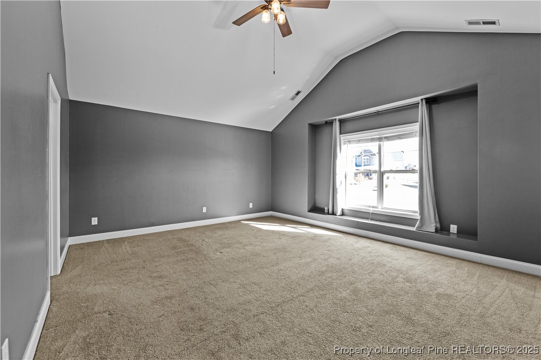 178 Tun Tavern Drive Cameron, NC 28326 - Photo 15 of 30 an empty room with a empty space and a ceiling fan