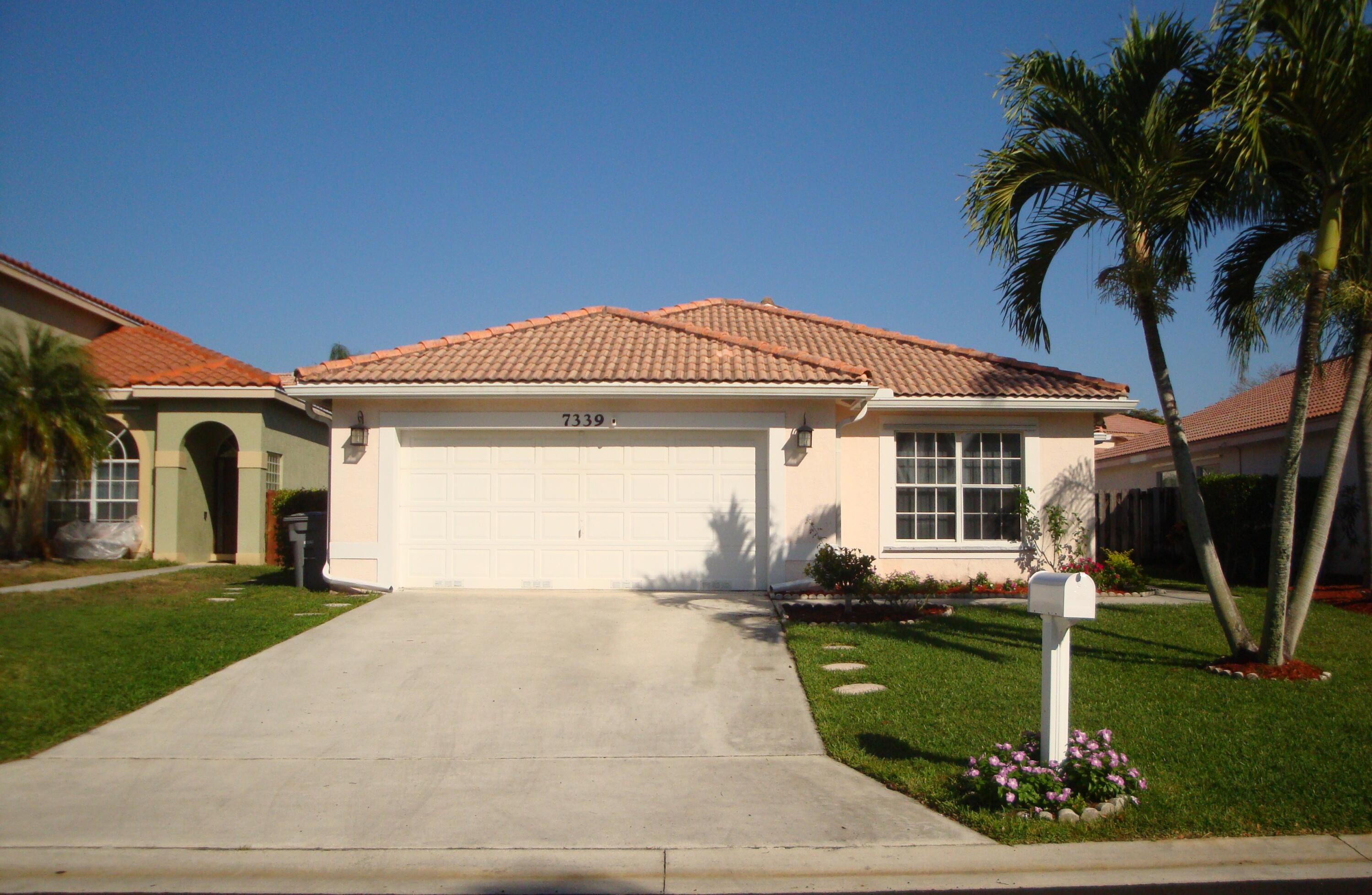 7339 Michigan Isle Road Lake Worth, FL 33467 - Photo 2 of 26 2 Car Garage