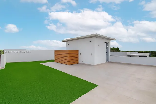 a view of backyard with trampoline