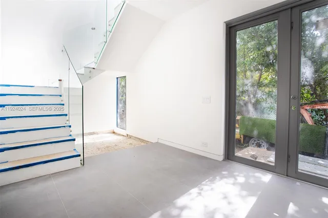 a view of an empty room and window